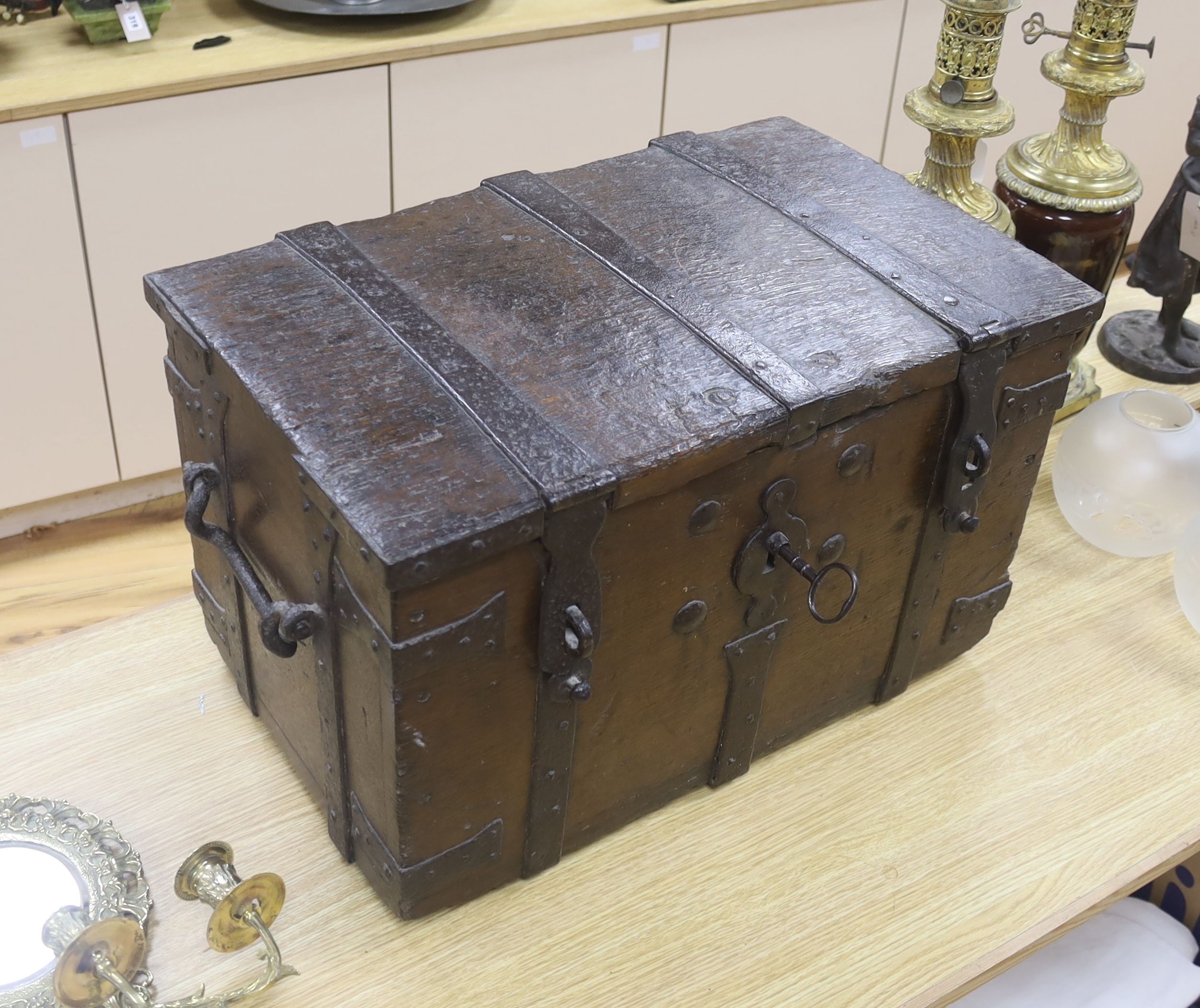 A 17th/18th century iron bound oak strong box, 60cm wide, 36cm deep, 35.5cm high